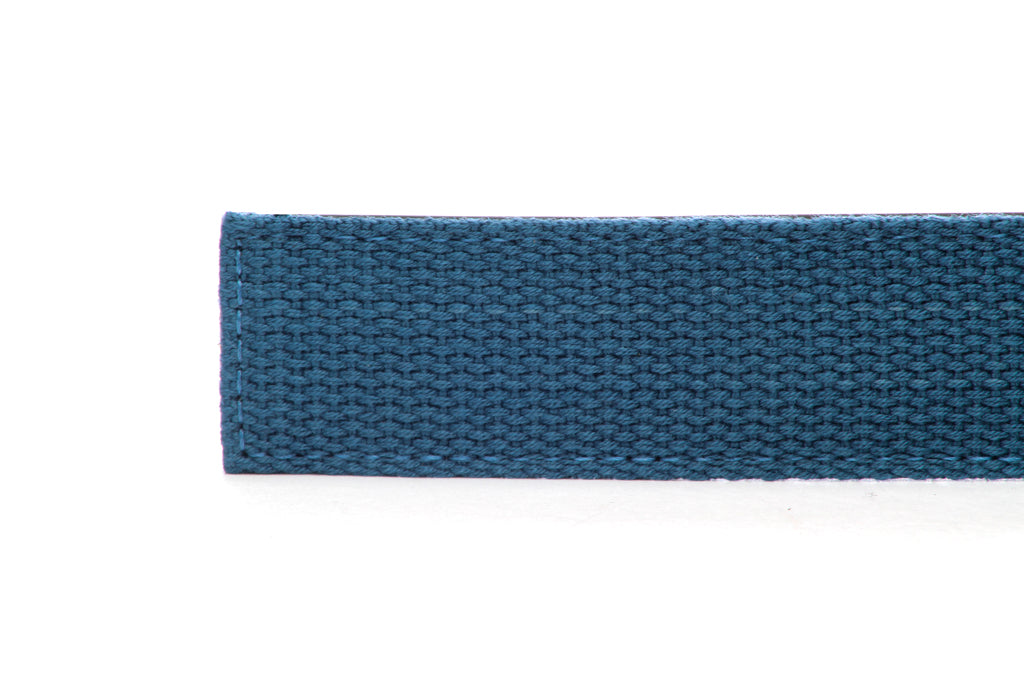 Men's canvas belt strap in marine blue with a 1.25-inch width, casual look, tip of the strap
