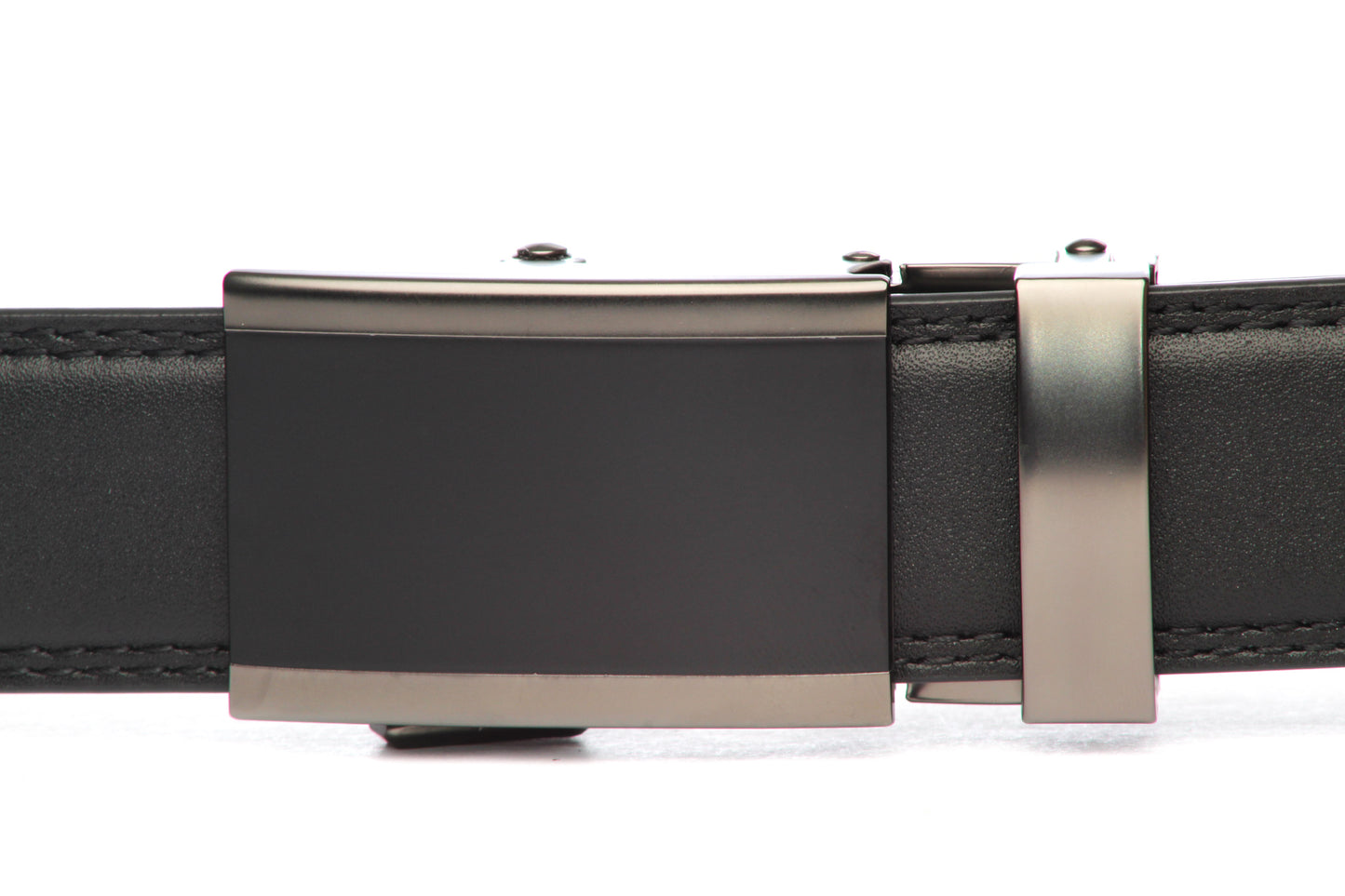 Men's onyx ratchet belt buckle in matte gunmetal with a 1.25-inch width, front view.