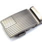 Men's USA flag ratchet belt buckle in gunmetal with a width of 1.5 inches, oblique view.