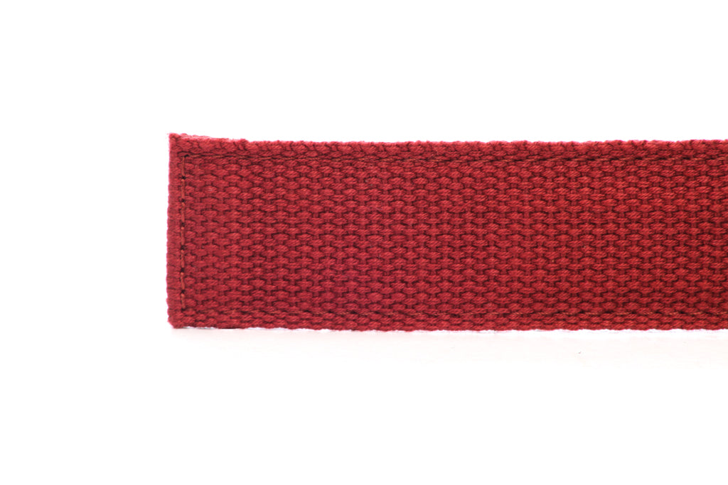 Men's canvas belt strap in crimson with a 1.25-inch width, casual look, tip of the strap