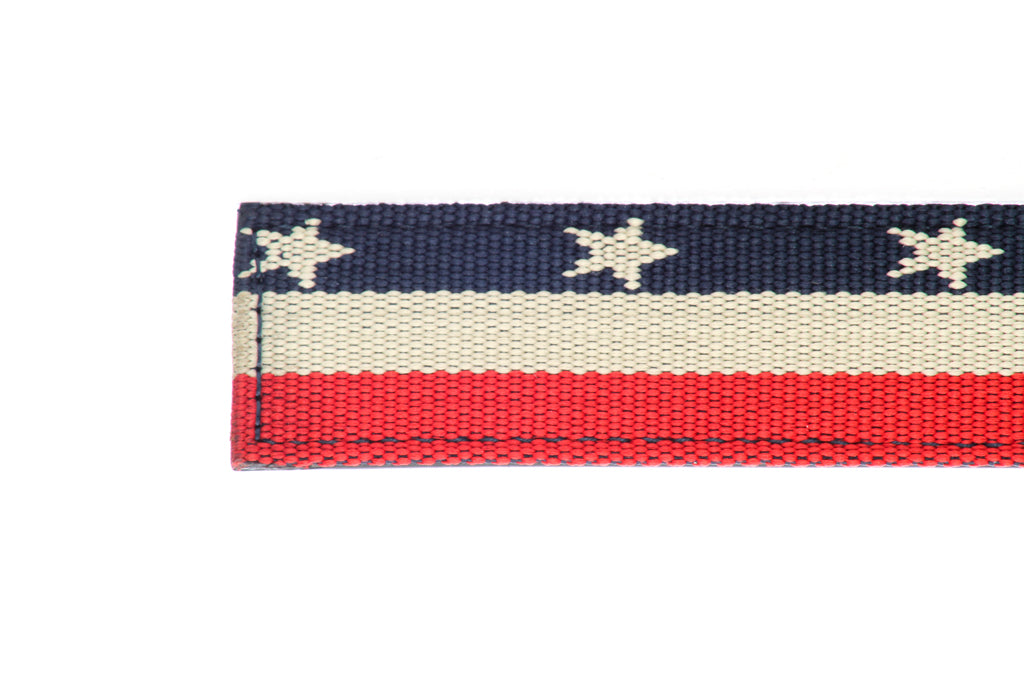 Men's canvas belt strap in stars and stripes with a 1.25-inch width, casual look, tip of the strap