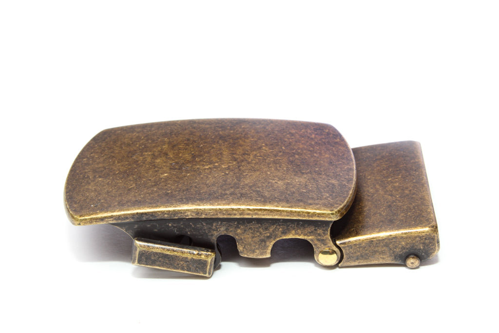 Men's classic with a curve ratchet belt buckle in antiqued gold with a width of 1.5 inches, left side view.
