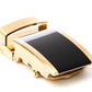Men's onyx ratchet belt buckle in gold with a 1.25-inch width, oblique view.