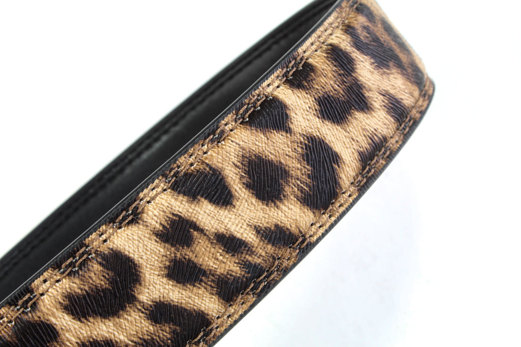 Women's vegan leather belt strap in leopard, 1.25 inches wide, casual look, curled up